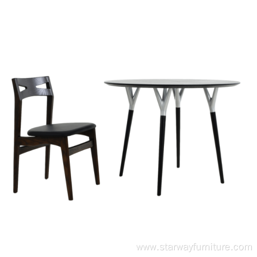 Home Styles round wooden dining table